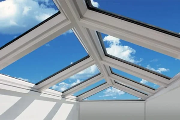 Clean white-framed roof lantern letting daylight into a bright interior