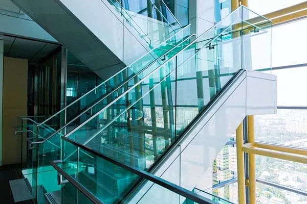Glass balustrades with stainless steel handrails on a commercial staircase