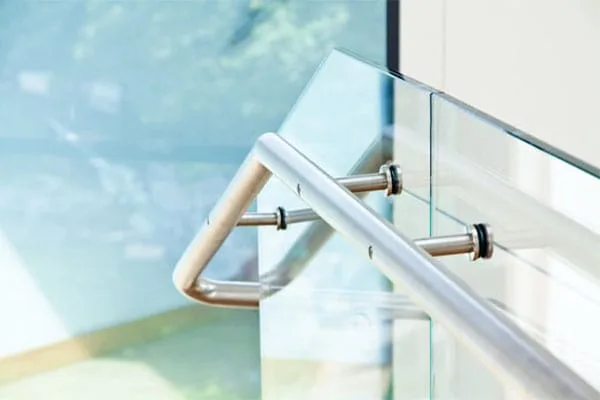 Stainless steel handrail detail on a frameless glass balustrade