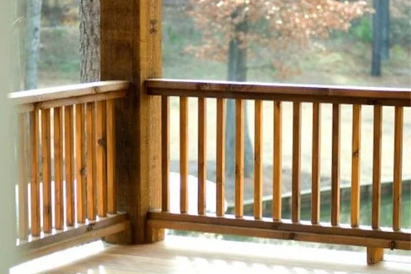 Timber porch railing with vertical wooden balusters