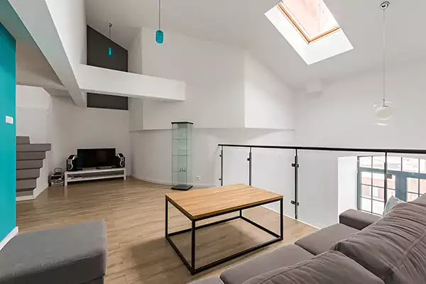 Indoor glass balustrade on a mezzanine level in a modern living space