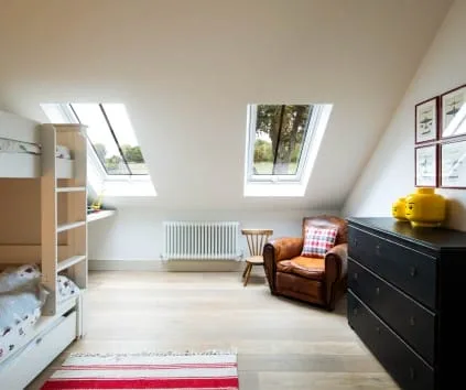 Bright loft conversion bedroom with two pitched rooflights