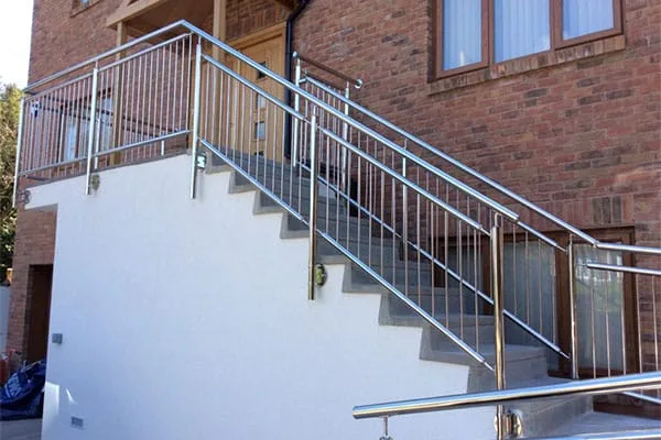 Stainless steel balustrade with vertical bars on an external staircase