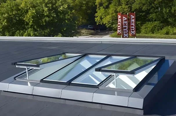Opening flat rooflights on a weathered upstand