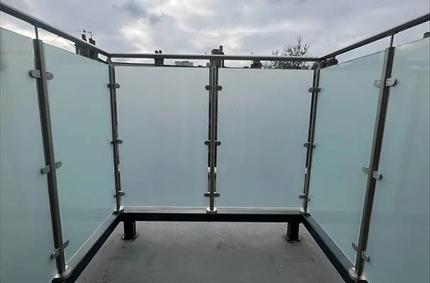 Frosted glass balustrade with stainless posts on a waterproofed roof terrace